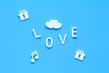 two hearts, gifts, note, the word LOVE. background blue