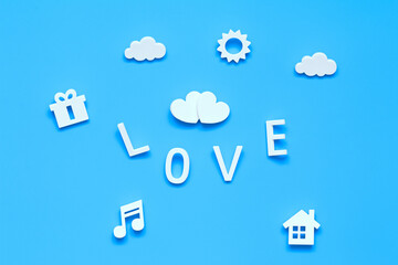 love and peace concept. two hearts, hom, love, gifts, sun and clouds on a blue background