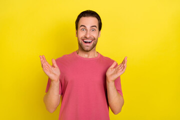 Photo of crazy positive amazed funky guy funky wow reaction wear pink t-shirt isolated yellow color...