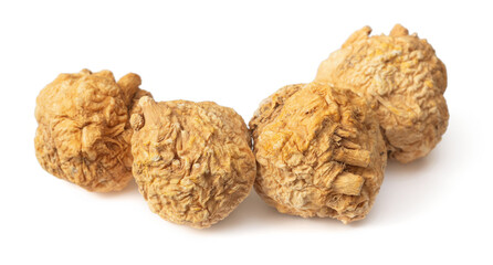 Dried yellow Maca roots isolated on white background