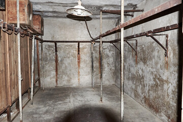 Old abandoned cellar with concrete walls. Spooky room in ruin building.