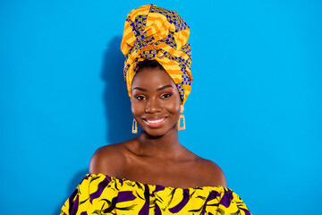 Portrait of charming cheerful dark skin girl beaming smile look camera isolated on blue color...