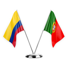 Two table flags isolated on white background 3d illustration, colombia and portugal