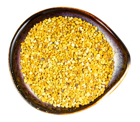 top view of ceramic bowl with natural bee pollen