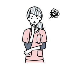 立って手をあごにあてて困っている看護師の女性