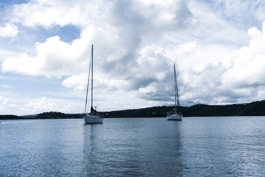 Two sail boats on calm waters outside Antigua, Caribbean