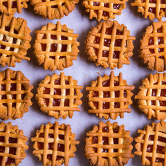 Cookies with jam on a wooden table, pastry, close-up,