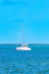 Fototapeta premium Panorama landscape view Holbox island turquoise water and boats Mexico.