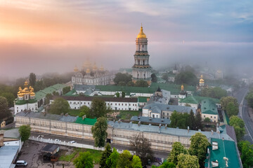 Aerial view of the Kiev-Pechersk Lavra at dawn, covered with thick fog. Kiev, Ukraine