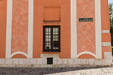 The facade of the tenement house, a plate with the inscription - Kanoniczna Street in Krakow, Poland.