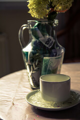 yellow dry flowers in a vase where instead of water of money. flowers grow out of money. vase floor money Euro dollars