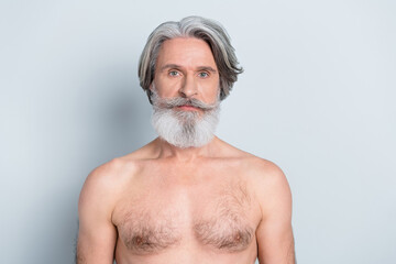 Photo of serious confident senior guy topless dark white beard isolated grey color background