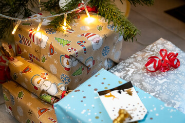 Fototapeta na wymiar Festive wrapped Christmas gifts and Christmas presents under the xmas tree shows decorative unboxing event with traditional celebration of handmade winter season for sparkling children eyes beauty