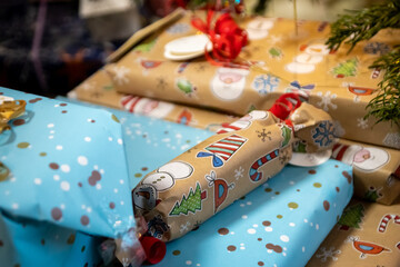 Fototapeta na wymiar Festive wrapped Christmas gifts and Christmas presents under the xmas tree shows decorative unboxing event with traditional celebration of handmade winter season for sparkling children eyes beauty