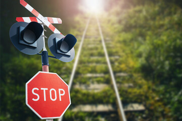 Stop sign background. Long railway landscape. Road sign suggesting caution. Watch out for a train....