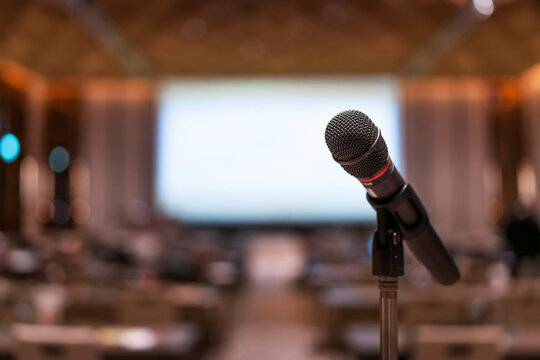 Microphone in meeting room for a conference.Public speaking backgrounds, Close-up the microphone on stand for speaker speech presentation stage performance