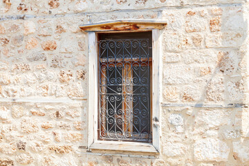 Fototapeta na wymiar Window of old building close up. Traditional Ottoman style wooden architecture. Historical building at turkish town