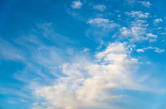 Blue sky with soft puffy clouds