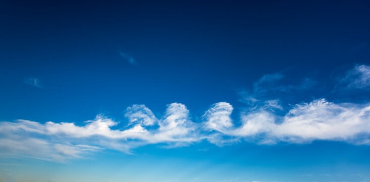 Stratocumulus floccus formation of clouds against blue sky