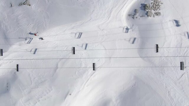 Chairlift and Ski Slope From Above. High quality video footage