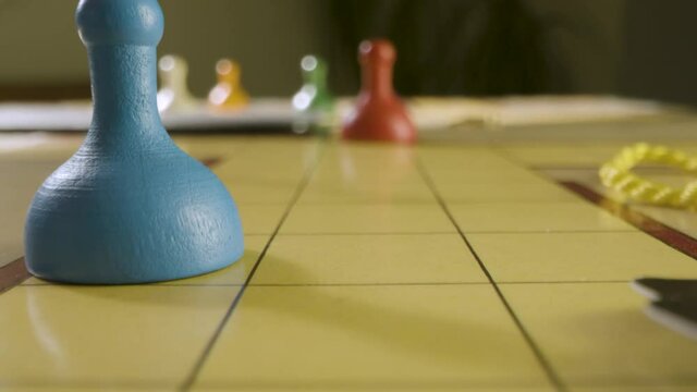 Close Up Rolling Die and Moving Pawn in Cluedo Game. High quality video footage