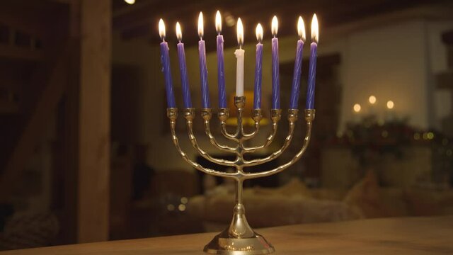 Close Up Shot of Candles On Menorah Burning During Hanukkah Celebrations. High quality video footage