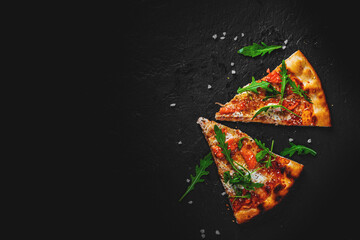 two slice of Pizza with Mozzarella cheese, salmon fish, tomato sauce, arugula. Italian pizza on...