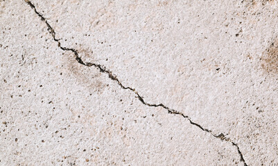 Cracks of the cement floor. Damaged building caused by the earthquake disaster. The fracture on the...