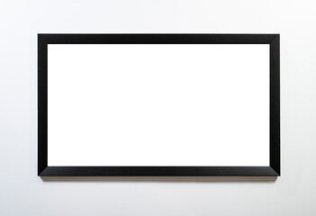 Empty black horizontal frame handing on white wall