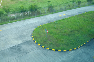 View from above of the parking area with a cement concrete surface for vehicles to turn around.