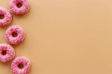 Group of glazed pink donutes. Sweet bakery background