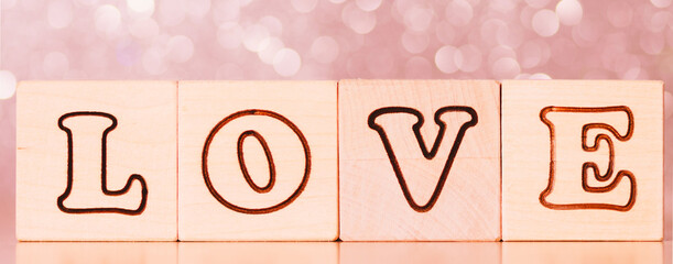 concept of love, the inscription love from wooden cubes