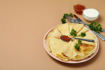 Concept of tasty food with crepes on brown background
