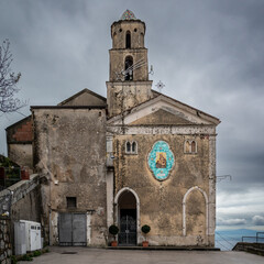 San Michele chapel with tiled Virgin Mary decoration  Furore, Agerola, Amalfi coast, Italy, under gray cloudy sky - obrazy, fototapety, plakaty