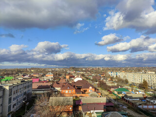 Clouds over russian town, autumn or winter cityscape
