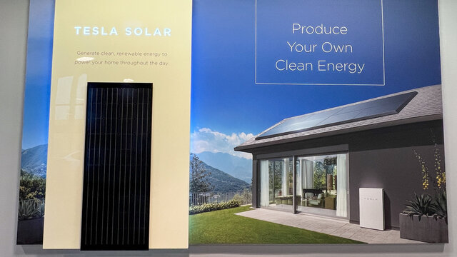 The Tesla Powerwall and Solar Sign at the entrance of the Tesla dealership in Orlando, FL.