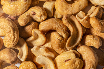 Tasty cashew nuts as background, top view