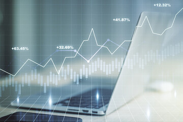 Double exposure of abstract creative financial diagram on modern laptop background, banking and accounting concept