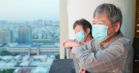 senior couple looking outside - Powered by Adobe