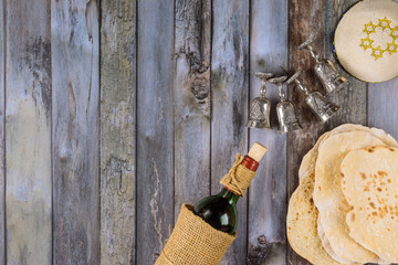 Matzoh, silver seder plate and kosher four cup wine for jewish passover