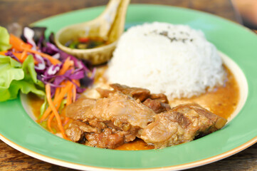 stewed pork ,pork with rice and sauce or rice topped with stew pork
