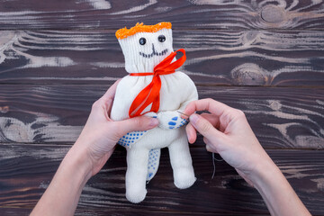 Children's craft soft toy made of gloves, felt and cotton wool for Valentine's Day. DIY concept....