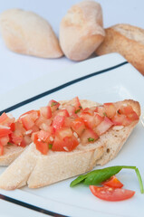 tomatoe bread and oil in a kitchen 