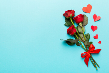 Valentine day composition with rose flower and red heart on table. Top view, flat lay, copy space...