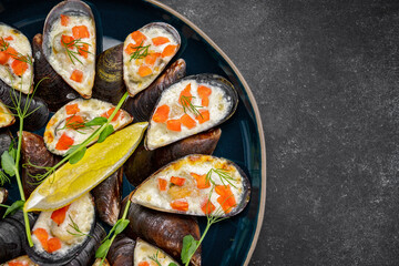 Mussels on a plate with baked cheese and red fish cubes