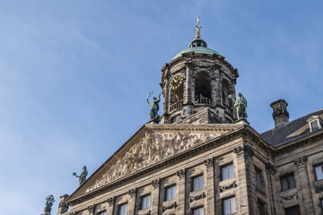 Fototapeta na wymiar Architectural fragments of Amsterdam Royal Palace building (Koninklijk Paleis) at Dam Square. Classicism style Palace built as city hall during Dutch Golden Age (1648 - 1655). Amsterdam, Netherlands.