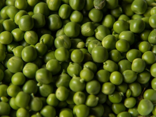 Green colour background of vegetable peas. Useful for design purpose.