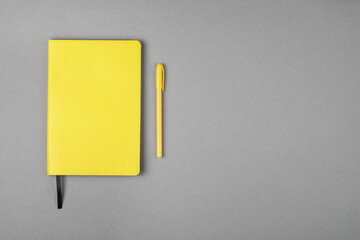 Flat lay, office desk view. Workspace with yellow notepad, pen. Minimal design, copy space.