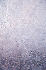 Winter frost on the window glass, ice purple pattern