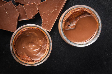 chocolate pudding souffle cocoa cream, cream, vanilla sweet dessert healthy meal food snack on the table copy space food background rustic top view